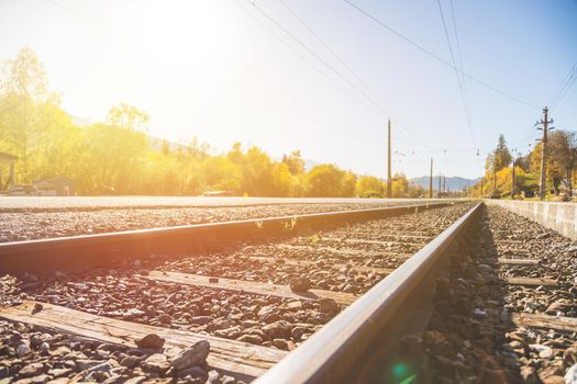Landscape of an old abandoned railway in fall. Warm light, sustainable traveling