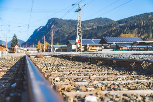 Landscape of an old abandoned railway in fall. Warm light, sustainable traveling