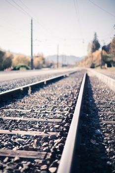 Landscape of an old abandoned railway in fall. Warm light, sustainable traveling