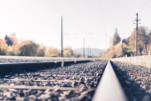 Landscape of an old abandoned railway in fall. Warm light, sustainable traveling