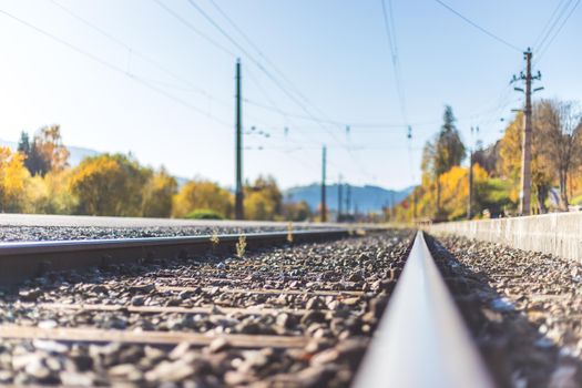 Landscape of an old abandoned railway in fall. Warm light, sustainable traveling