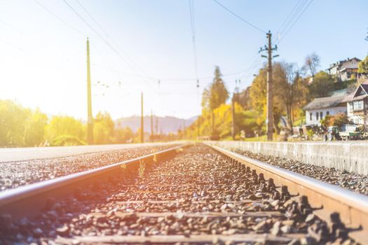 Landscape of an old abandoned railway in fall. Warm light, sustainable traveling