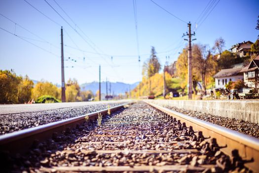 Landscape of an old abandoned railway in fall. Warm light, sustainable traveling