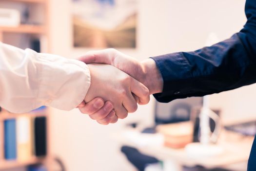 Man and woman are shaking hands, close up image, concept for human relationships
