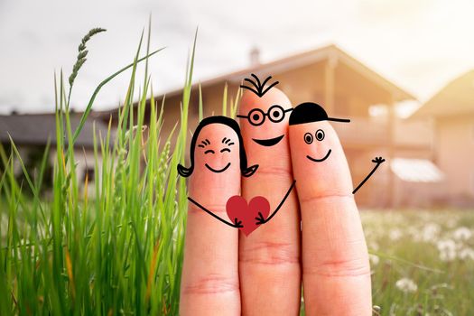 Painted fingers happy family concept moving into a new home