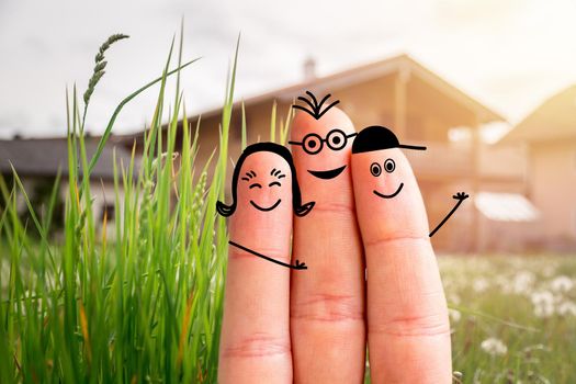 Painted fingers happy family concept moving into a new home