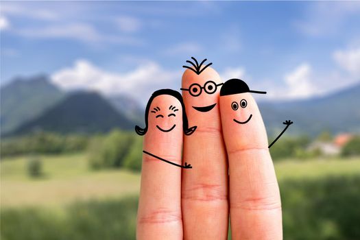 Painted fingers happy family concept making holidays in nature