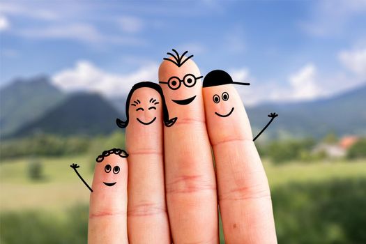 Painted fingers happy family concept making holidays in nature