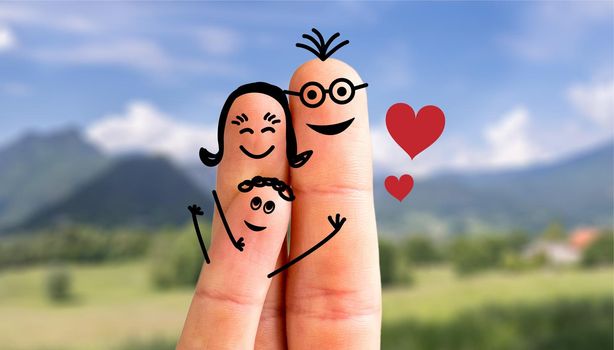 Painted fingers happy family concept making holidays in nature