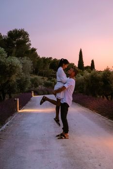 couple walking path with lavender during sunset in the Provence France Europe