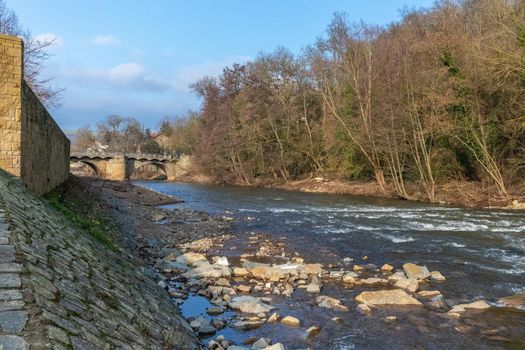 The river glan and stone bridge in Meisenheim, Germany