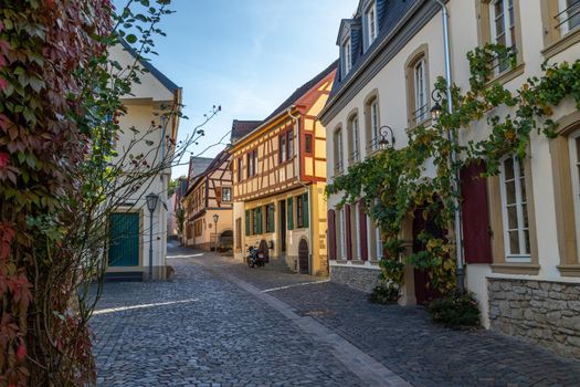 Cobbled road with historic, half-timbered houses in Meisenheim, Rhineland-Palatinate, Germany 