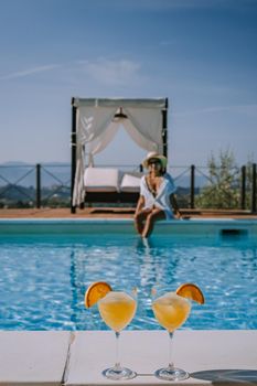 Luxury country house with swimming pool in Italy. Pool and old farm house during sunset central Italy. Couple on Vacation at luxury villa in Italy, men and woman watching sunset