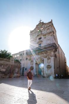 men on citytrip, Ortigia in Syracuse Sicily Italy in the Morning. Travel Photography from Syracuse, Italy on the island of Sicily. 