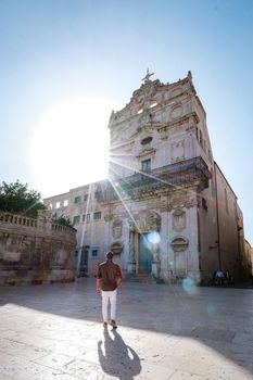 men on citytrip, Ortigia in Syracuse Sicily Italy in the Morning. Travel Photography from Syracuse, Italy on the island of Sicily. 