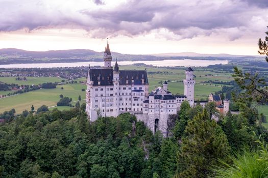 Beautiful view of world-famous Neuschwanstein Castle, the nineteenth-century Romanesque Revival palace built for King Ludwig II on a rugged cliff near Fussen, southwest Bavaria, Germany. Europe