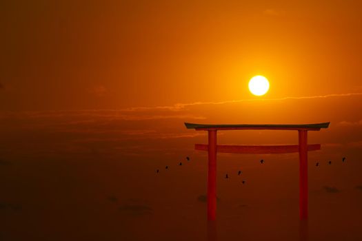 torii sunset orange red cloud on sky and birds flying on the sea