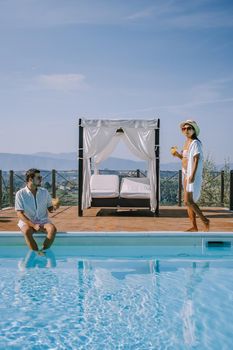 Luxury country house with swimming pool in Italy. Pool and old farm house during sunset central Italy. Couple on Vacation at luxury villa in Italy, men and woman watching sunset