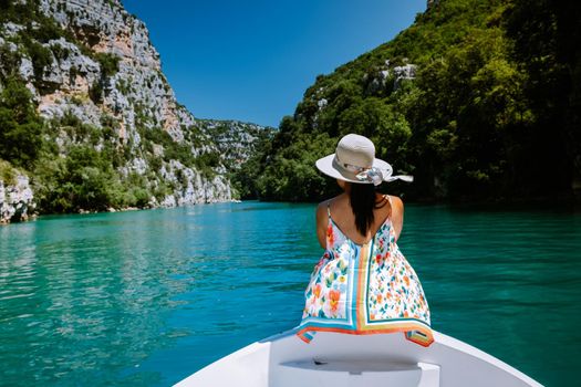 young girl view to the cliffy rocks of Verdon Gorge at lake of Sainte Croix, Provence, France, near Moustiers SainteMarie, department Alpes de Haute Provence, region Provence Alpes Cote Azur. France