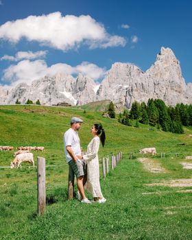 couple men and woman on vacation in the Italian Dolomites Italy. Europe
