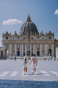 St. Peter's Basilica in the morning from Via della Conciliazione in Rome. Vatican City Rome Italy. Rome architecture and landmark. St. Peter's cathedral in Rome. Couple on city trip