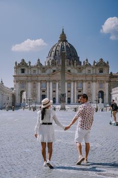 St. Peter's Basilica in the morning from Via della Conciliazione in Rome. Vatican City Rome Italy. Rome architecture and landmark. St. Peter's cathedral in Rome. Couple on city trip