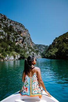 young girl view to the cliffy rocks of Verdon Gorge at lake of Sainte Croix, Provence, France, near Moustiers SainteMarie, department Alpes de Haute Provence, region Provence Alpes Cote Azur. France