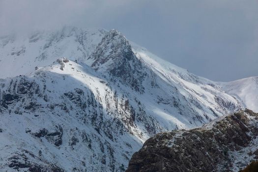 Snowy mountains landscape in the Aragonese Pyrenees. Selva de Oza valley, Hecho and Anso, Huesca, Spain.