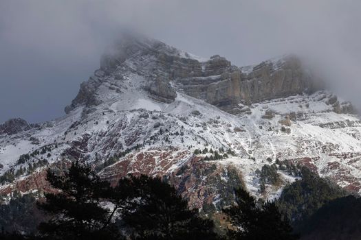 Snowy mountains landscape in the Aragonese Pyrenees. Selva de Oza valley, Hecho and Anso, Huesca, Spain.