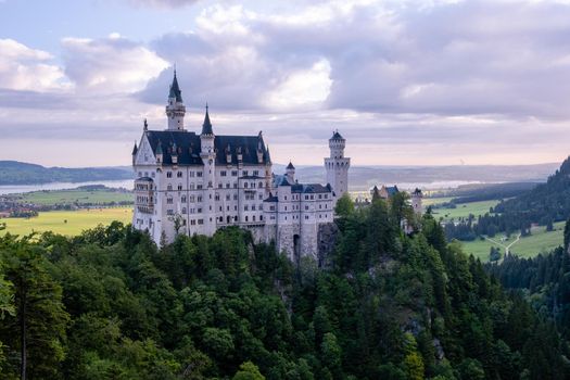 Beautiful view of world-famous Neuschwanstein Castle, the nineteenth-century Romanesque Revival palace built for King Ludwig II on a rugged cliff near Fussen, southwest Bavaria, Germany. Europe