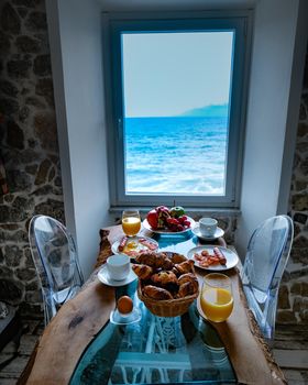 breakfast with a view over the ocean from the window,Cefalu, medieval village of Sicily island, Province of Palermo, Italy. Europe