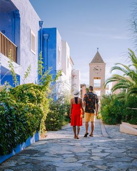 Crete Greece, Candia park village a luxury holiday village in Crete Greece by the ocean in traditional colors. Couple on vacation luxury resort