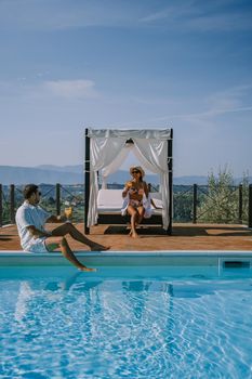 Luxury country house with swimming pool in Italy. Pool and old farm house during sunset central Italy. Couple on Vacation at luxury villa in Italy, men and woman watching sunset