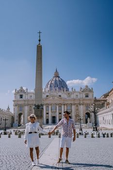 St. Peter's Basilica in the morning from Via della Conciliazione in Rome. Vatican City Rome Italy. Rome architecture and landmark. St. Peter's cathedral in Rome. Couple on city trip