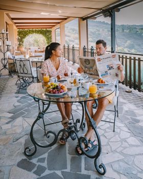 couple having breakfast at luxury villa at the Italian country side near Rome Italy. 