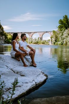 couple on vacation in Ardeche France, view of the village of Vogue in Ardeche. France Europe