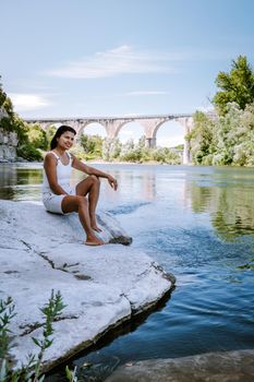 woman on vacation in Ardeche France, view of the village of Vogue in Ardeche. France Europe