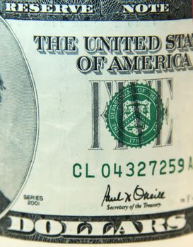 side of the dollar where is the serial number and the inscription dollars