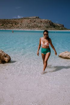 Balos Beach Crete Greece, Balos beach is on of the most beautiful beaches in Greece at the Greek Island, woman in a swimsuit on the beach