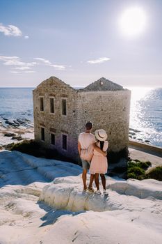 Punta Bianca, Agrigento in Sicily Italy White beach with old ruins of an abandoned stone house on white cliffs. Sicilia Italy, couple on vacation in Italy