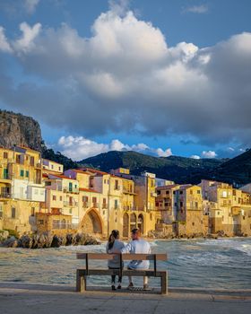 Cefalu, the medieval village of Sicily island, Province of Palermo, Italy. Europe, a couple on vacation at the Italian Island Sicilia