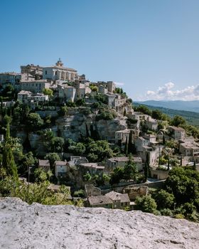 View of Gordes, a small medieval town in Provence, France. A view of the ledges of the roof of this beautiful village and landscape. Europe