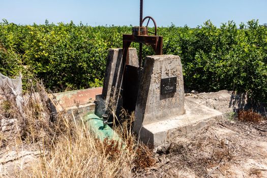 old sluice gates on spanish orange plantation or grove