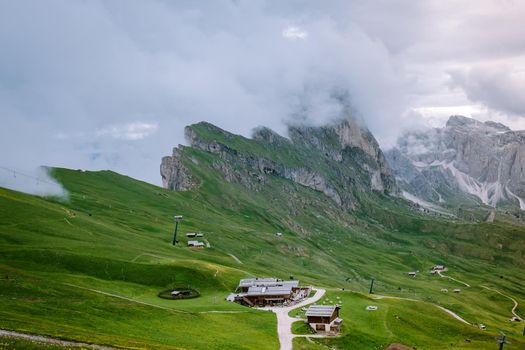  hiking in the Italien Dolomites, Amazing view on Seceda peak. Trentino Alto Adige, Dolomites Alps, South Tyrol, Italy, Europe. Odle mountain range, Val Gardena. Majestic Furchetta peak in morning sunlight. Italy