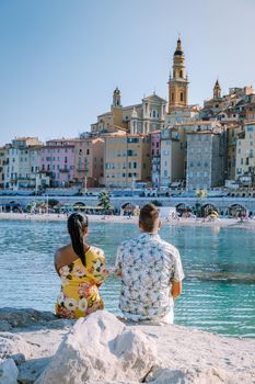 Menton France,couple men and woman on vacation at the Cote d Azur France, View on old part of Menton, Provence-Alpes-Cote d'Azur, France Europe