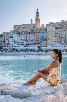 Menton France, woman on vacation at the Cote d Azur France, View on old part of Menton, Provence-Alpes-Cote d'Azur, France Europe