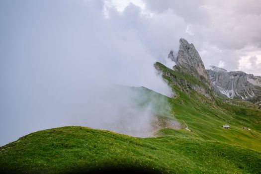  hiking in the Italien Dolomites, Amazing view on Seceda peak. Trentino Alto Adige, Dolomites Alps, South Tyrol, Italy, Europe. Odle mountain range, Val Gardena. Majestic Furchetta peak in morning sunlight. Italy