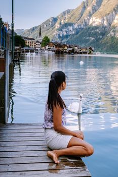 woman visit during summer vacation Hallstatt village on Hallstatter lake in Austrian Alps Austria Europe