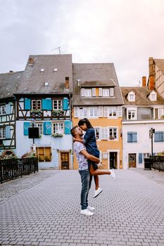 couple on city trip Colmar, Alsace, France. Petite Venice, water canal and traditional half timbered houses. Colmar is a charming town in Alsace, France. Beautiful view of colorful romantic city Colmar