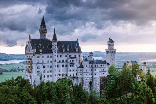 Beautiful view of world-famous Neuschwanstein Castle, the nineteenth-century Romanesque Revival palace built for King Ludwig II on a rugged cliff near Fussen, southwest Bavaria, Germany. Europe